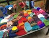 Just a few of the over 700 hand-made hats donated to Back to School Shop for it's 7th annual event in July.