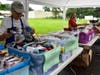 Volunteers preparing items for the children's backpacks.