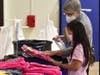A shopper looks for the perfect backpack. 