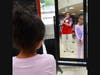 A shopper admires her new outfit.