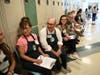 Volunteer "Personal Shoppers" waiting for their shoppers to be assigned.