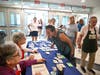Volunteers checking in for their shift at the twelfth annual Back to School Shop event. 
