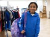 Happy shopper poses in her new hoodie and backpack.