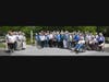 Pennswood Village residents with Mira Nakashima and Jonathon Yarnall for dedication of new Pennwood Peace Pole with "May Peace Prevail on Earth" in French, Chinese, Russian, Japanese, Spanish, German, Ukrainian, Italian, Hindi, Arabic, Hebrew, and English