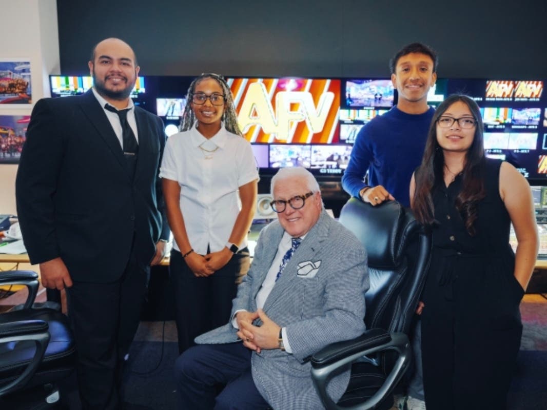 (L to R) Boyle Heights YMCA chaperone David Haro, student Morgan Crafton, chaperone Kevin O. Campos and student Aalijah Perez in studio with “America’s Funniest Home Videos” creator and executive producer Vin Di Bona (center) during a field trip.
