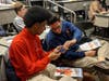 St. Rita High School students take a look at medical equipment used during an open heart surgery. 