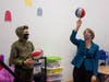Attorney General Maura Healey spins basketball at Lynn Youth Center.