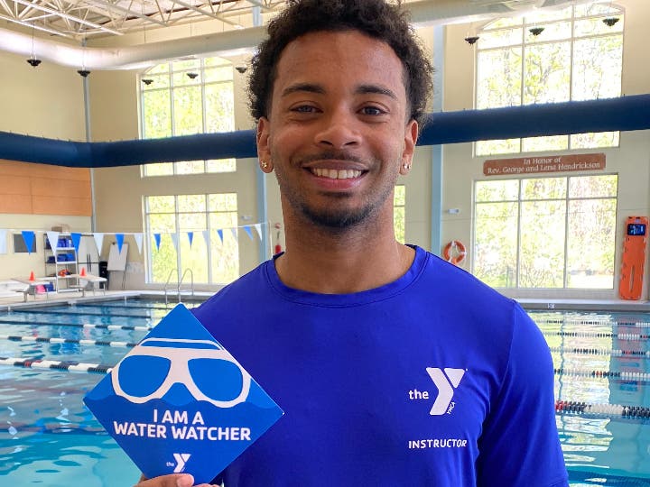Torigian Family YMCA Aquatics Director, Chris Morales, encourages families to take the Water Watcher Pledge.