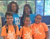 Newly appointed Association Director of Community Outreach for the Freehold Borough YMCA Community Center Jo Ann Rountree (back row, left) and Lemmeca Hickman take a break from summer camp activities with (left to right) Cameron Berrios, Adriana Pagan and