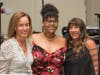 Event co-chairpersons Irene Hall (left) and Lauren Berke (far right) thank Onestie Jackson for sharing an inspiring story of the Y’s impact on her life.