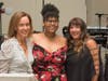 Event co-chairpersons Irene Hall (left) and Lauren Berke (far right) thank Onestie Jackson for sharing an inspiring story of the Y’s impact on her life.