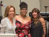 Event co-chairpersons Irene Hall (left) and Lauren Berke (far right) thank Onestie Jackson for sharing an inspiring story of the Y’s impact on her life.
