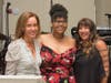 Event co-chairpersons Irene Hall (left) and Lauren Berke (far right) thank Onestie Jackson for sharing an inspiring story of the Y’s impact on her life.