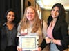 Ashley Biddle (center), the Y's Civic Engagement Program Coordinator, celebrates being honored with the Gail C. Jochen YMCA Values Award at the Model UN conference with delegation officers Alessa Alex and Skriti Nakkeeran from Freehold High School.