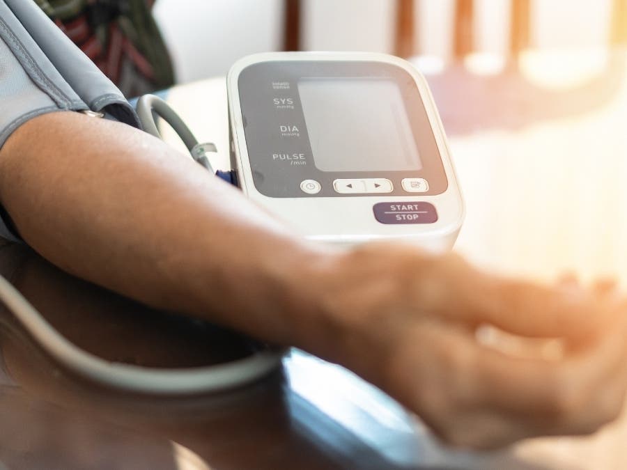 Elderly patient with bp, heart rate, digital pulse check equipment for medical geriatric awareness in stroke systolic high blood pressure, h