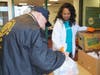 Jo Ann Rountree, senior director of community outreach for the YMCA, distributes meals at the Freehold Borough YMCA to help strengthen the community. 