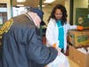Jo Ann Rountree, senior director of community outreach for the YMCA, distributes meals at the Freehold Borough YMCA to help strengthen the community. 