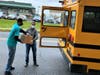 YMCA President and CEO Laurie Goganzer and David Thomas unload boxes of donated food to share with greater Monmouth County residents as part of a food distribution program. 