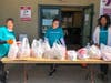 YMCA team members distribute food to local families in need in the Freehold area. 
 