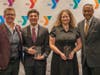 Togetherhood Champion Award winners Jayden and Yulissa Gomez with Y President and CEO Laurie Goganzer and event Chairman Michael Wright. 