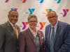 Event Chairman Michael Wright and Y President and CEO Laurie Goganzer with keynote speaker the Rev. Dale Caldwell.