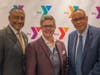 Event Chairman Michael Wright and Y President and CEO Laurie Goganzer with keynote speaker the Rev. Dale Caldwell.