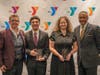 Togetherhood Champion Award winners Jayden and Yulissa Gomez with Y President and CEO Laurie Goganzer and event Chairman Michael Wright.