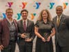 Togetherhood Champion Award winners Jayden and Yulissa Gomez with Y President and CEO Laurie Goganzer and event Chairman Michael Wright. 