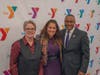 Featured speaker at the YMCA’s Dr. King celebration Maysa Akbar, Ph.D., (center) with Y President and CEO Laurie Goganzer and Chief Volunteer Officer Michael A. Wright. 