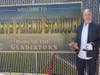 Legendary Steve Friend stands next his sign