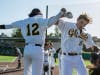 Chabot power players Matt Sugden and Fernando Sansone celebrate after a grand slam against Canada.