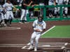 Jon Jon Gazdar touches home plate after a Fred Ramos double.