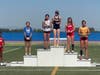 Andie Aymond stands atop podium
