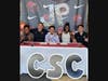 Jalen Patterson is with his coach and friends doing a signing ceremony.