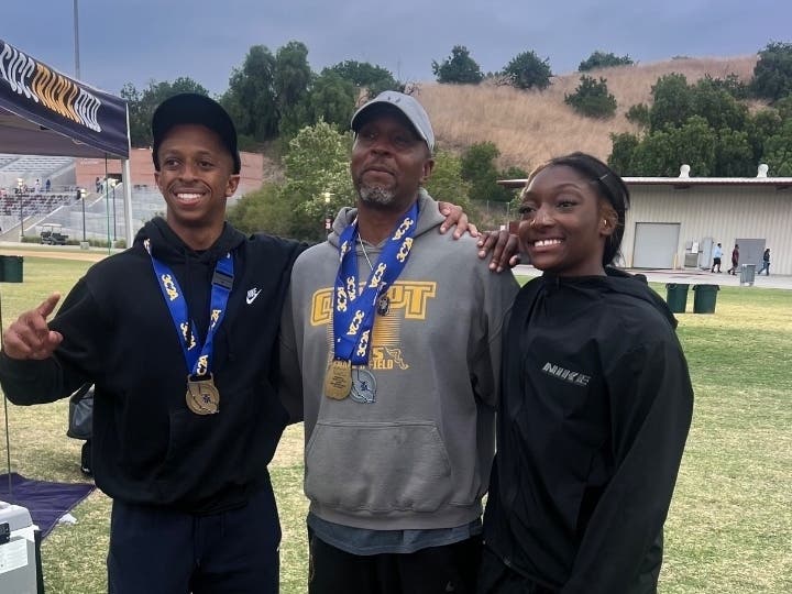 Chabot’s Jamal Perry and Nyarah Anderson-Brown pose with sprint coach Jerry Craft