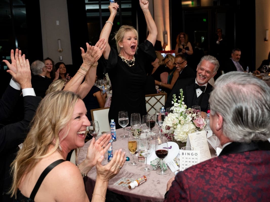 Mary Frances Isakov reacts to winning the All-Star Sports Prize package at Hospice of the Chesapeake's Bubbles & Bingo event held at the Fluegel Alumni Center on April 10, 2026. She was one of seven prize winners.