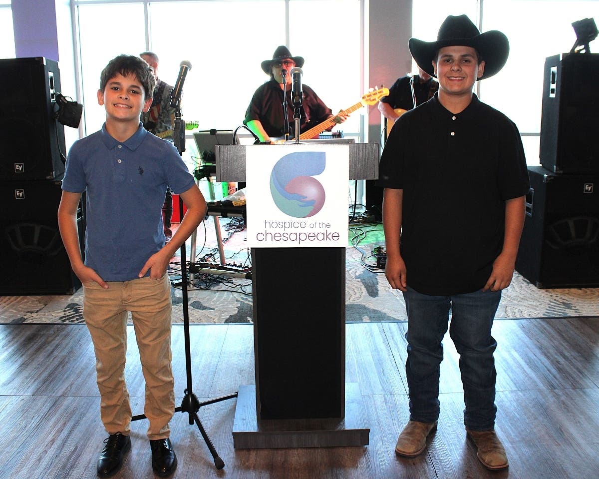 Brothers Ayden Said, left, and Lucas Said have continued the tradition started by the Ireland brothers and are raising Hoss, this year’s Hospice Hog.