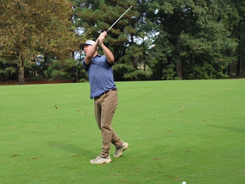 A golfer swings from the fairway during the 2025 Hospice of the Chesapeake Golf Tournament held at Queenstown Harbor Golf.