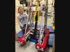 Capt. Grace Cink '22 with the TechTiger 2022 Robot inside the  Robotics Workshop at Mercy High School. 