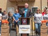 Woodbridge Mayor John McCormac speaks in front of the shelter on Monday.