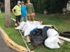 The volunteers show the incredible amount of debris they collected.