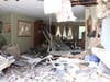 The dump truck plowed into their living room and dining area. The family was asleep in back rooms of the home.