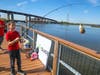 A boy catches a fish as part of the event at Laurel Hill county park in Secaucus.