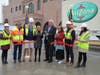 Woodbridge Mayor John McCormac cuts the ribbon with AriZona employees.