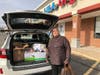 Shrewsbury’s office manager, Angela, loading the car with donations.