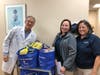 Dr. John Haddad and the staff of Chapel Hill Family Medicine getting their donations ready to drop off.