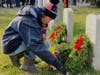 Jordan Codispoti​, 16, from Holmdel, lays a wreath last year.