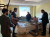 From left: Rabbi J.J. Hecht of Toys for Hospitalized Children, Moish plays guitar and Ray Lesniak with a child at Children's Specialized Hospital in New Brunswick this week.