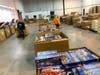 Secaucus DPW workers unload the boxes Monday morning.