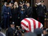 Seals' casket was draped in an American flag.